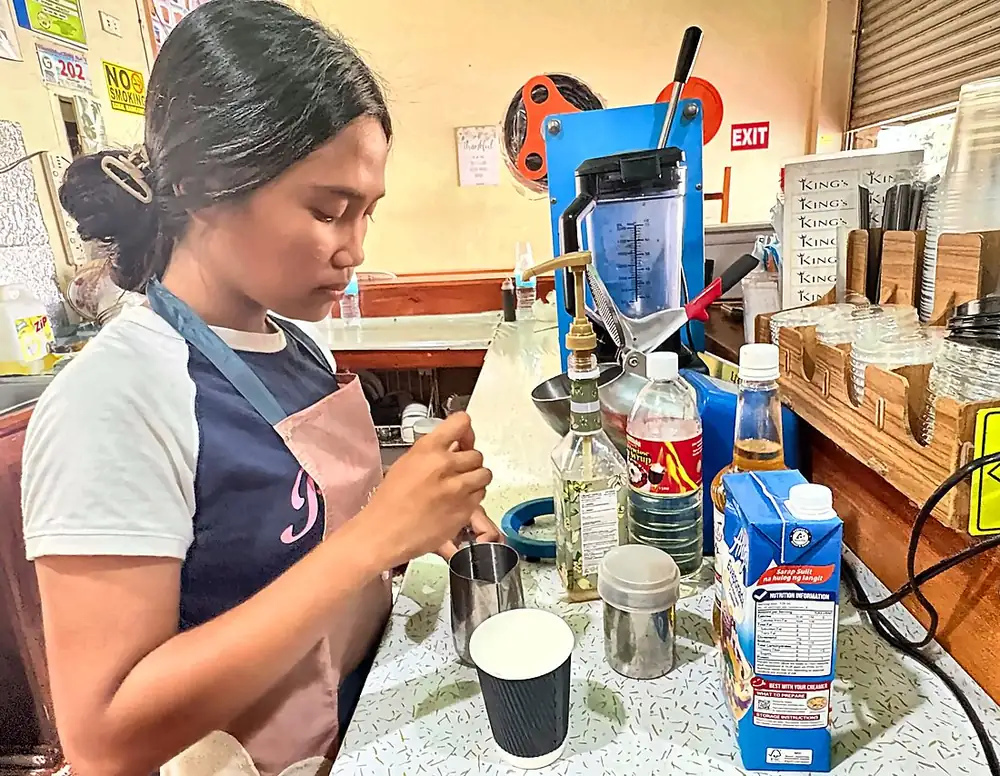 Our barista with a freshly made drink